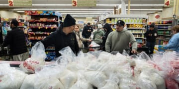 Families wait in line for hours to buy masa for Christmas tamales at beloved L.A. grocer