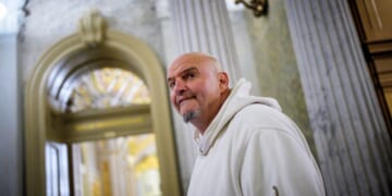 Sen. John Fetterman, one of eight Democrats to say he will vote with Republicans to open the government, arrives for votes on Nov. 10, 2025, on Capitol Hill in Washington, D.C.