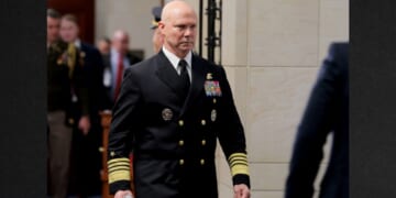 Navy Adm. Frank Bradley walks to a hold room between closed-door classified meetings with lawmakers on Capitol Hill on Thursday in Washington, DC. Members of the Senate and House Armed Services committees met with Bradley about the strikes on suspected drug boats out of Venezuela ordered by the Trump Administration.