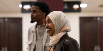 Rep. Ilhan Omar, a Democrat from Minnesota, laughs as she campaigns with Minneapolis mayoral candidate State Senator Omar Fateh on Election Day at the University of Minnesota on Nov. 4, 2025, in Minneapolis, Minnesota.