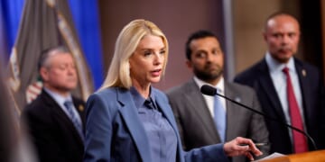 Attorney General Pam Bondi, accompanied by, FBI Director Kash Patel, FBI Deputy Director Dan Bongino, and FBI Washington Field Office Assistant Director in Charge Darren Cox, speaks during a news conference on an arrest of a suspect in the Jan. 6 pipe bombing case at the Department of Justice on Dec. 4, 2025, in Washington, D.C.