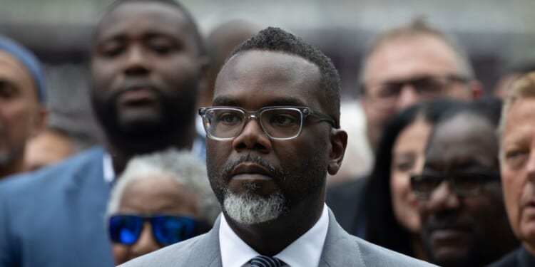 Chicago Mayor Brandon Johnson listens as Illinois Gov. J.B. Pritzker speaks at a news conference to address President Donald Trump's plan to send National Guard troops into the city on Aug. 25, 2025, in Chicago, Illinois.