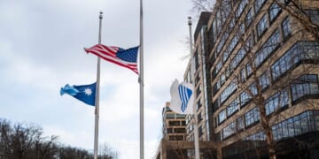Flags fly at half mast outside the United Healthcare corporate headquarters on Dec. 4, 2024, in Minnetonka, Minnesota.