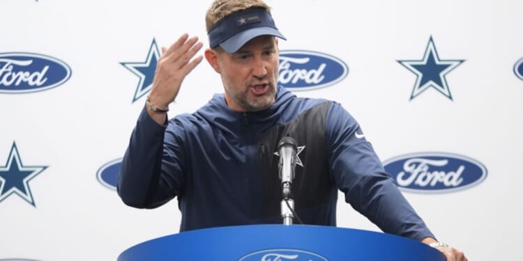 Dallas Cowboys head coach Brian Schottenheimer talks to reporters following Thursday's NFL football game against the Detroit Lions in Detroit.