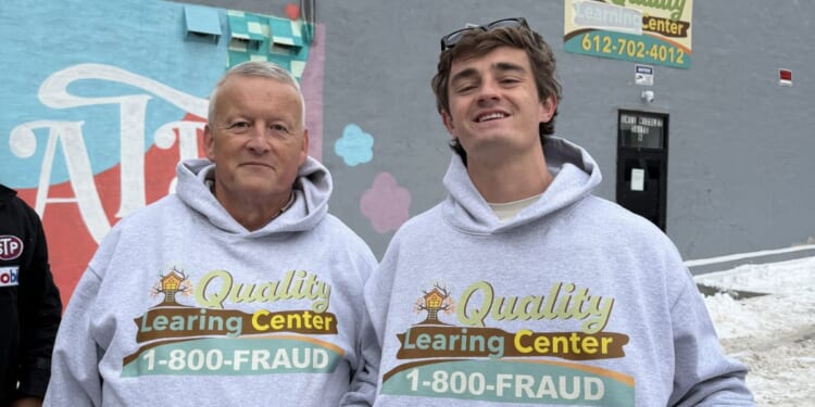 YouTuber Nick Shirley and the Minnesota fraud researcher known simply as "David" pose in "Quality Learing Center" sweatshirts outside the allegedly fraudulent facility in Minneapolis, Minnesota, on Dec. 30, 2025.