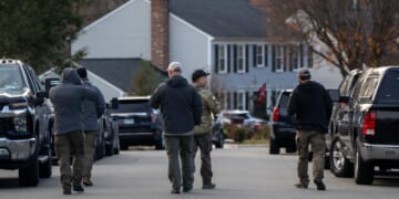 FBI agents gather in front of the home of the suspected Jan. 6, 2021, pipe bomber on Dec. 4, 2025, in Woodbridge, Virginia.