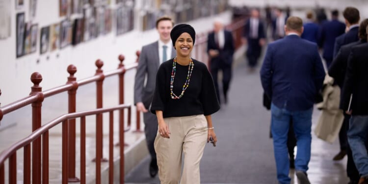 Rep. Ilhan Omar walks towards the U.S. Capitol Building on Dec. 10, 2025, in Washington, D.C.