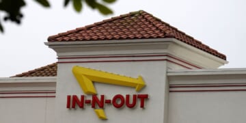 The In-N-Out Burger logo is displayed at an In-N-Out Burger restaurant on July 21, 2025, in Daly City, California.