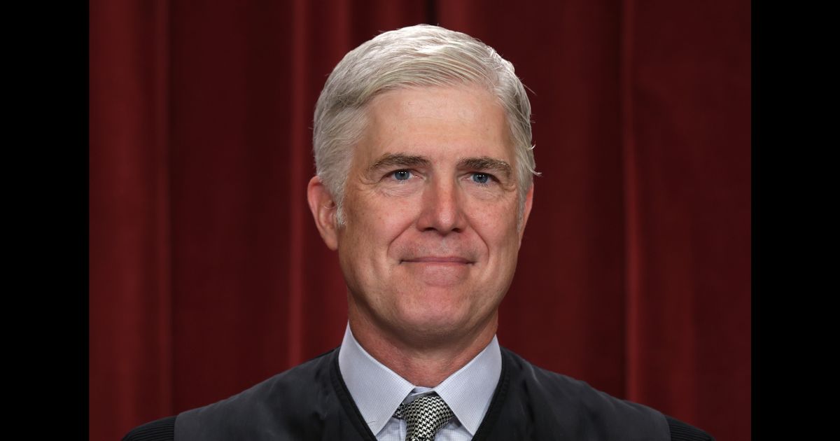 United States Supreme Court Associate Justice Neil Gorsuch poses for an official portrait in the Supreme Court building in Washington, DC on Oct. 7, 2022.