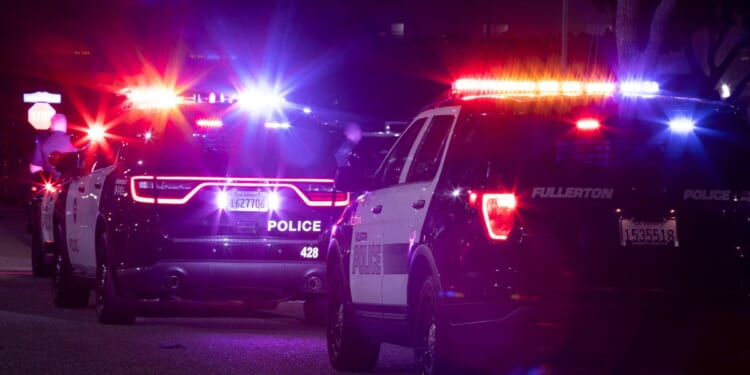 Fullerton Police Department units respond to the scene of a nighttime emergency on Dec. 11, 2022.