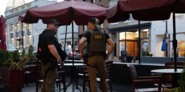 Drug Enforcement Administration personnel patrol M Street in Georgetown on Aug. 13, 2025, in Washington, D.C.