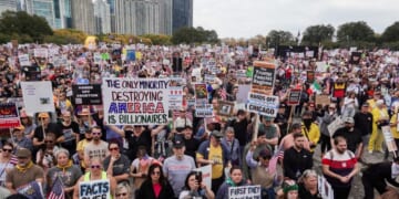 Protestors march in the second "No Kings" protest on Oct. 18, 2025, in Chicago, Illinois.