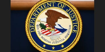 The seal of the U.S. Department of Justice.