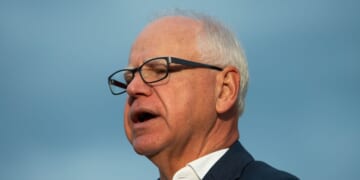Minnesota Gov. Tim Walz speaks to reporters at Deerwood Elementary in Eagan, Minnesota, on Sept. 2, 2025.