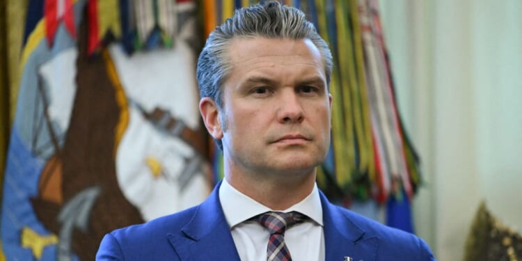 Secretary of War Pete Hegseth attends a Mexican Border Defense Medal presentation in the Oval Office of the White House in Washington, D.C., on Dec. 15, 2025.