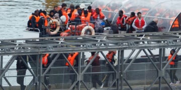 The U.K. Border Force vessel brings migrants who were intercepted crossing the English Channel into Dover port on Oct. 8, 2025, in Dover, England.