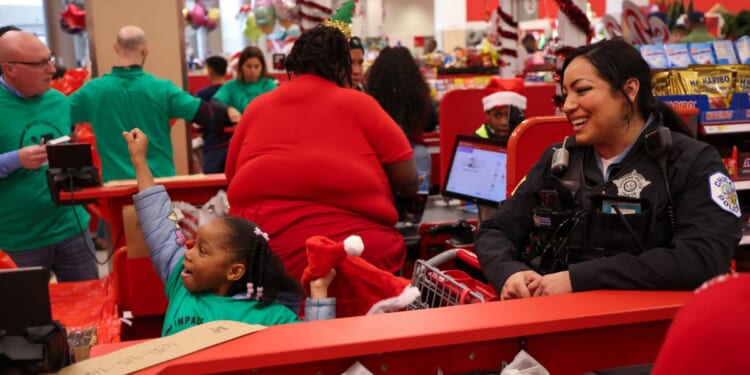 A Chicago Police officer participates in "Shop with a Cop," as shown in a post from the Chicago Police Department on Dec. 11, 2025.