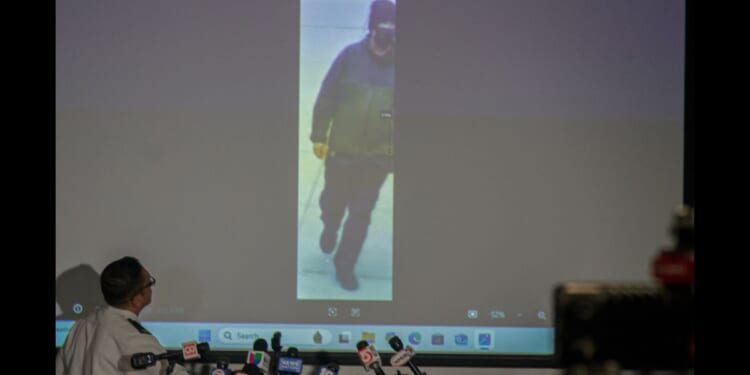 Police Chief of the Providence Police Department Colonel Oscar Perez shows an image of a person of interest in the Brown University shooting on Dec. 15, 2025 in Providence, Rhode Island.