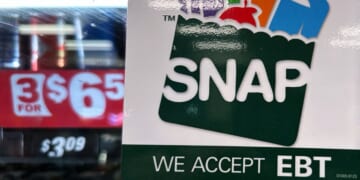 A SNAP EBT information sign is displayed at a gas station in Riverwoods, Illinois, on Nov. 1, 2025.
