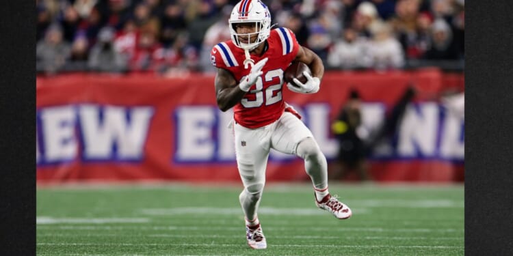 TreVeyon Henderson #32 of the New England Patriots runs with the ball Monday during the second quarter against the New York Giants at Gillette Stadium in Foxborough, Massachusetts.