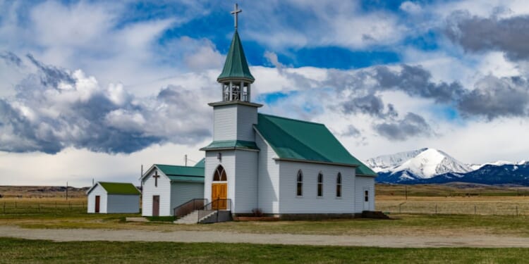 A picturesque church sits near the foot of Crazy Mountains outside of Big Timber, Montana.