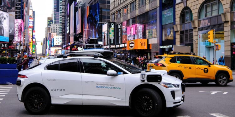 A Waymo autonomous self-driving Jaguar electric vehicle is seen in the Manhattan borough of New York City, on Dec.13. Waymo robotaxis are active in several large U.S. cities, sometimes presenting odd -- or dangerous -- challenges for police and those around them.