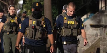 FBI agents walk down Florida Avenue on Aug. 13, 2025 as part of President Donald Trump's deployment of federal officers and the National Guard in Washington, DC.
