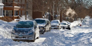 Snow covers a street in Minneapolis, Minnesota after a blizzard on Dec. 12, 2010.