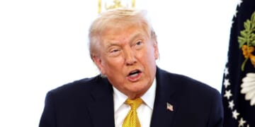 President Donald Trump calls service members on Christmas Eve at the Mar-a-Lago resort on Dec. 24, 2025, in Palm Beach, Florida.