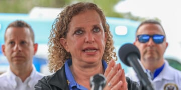 Rep. Debbie Wasserman Schultz, Rep. Jared Moskowitz, and Rep. Darren Soto during a press conference after visiting "Alligator Alcatraz" at the Dade-Collier Training and Transition Airport on July 12, 2025, in Ochopee, Florida.