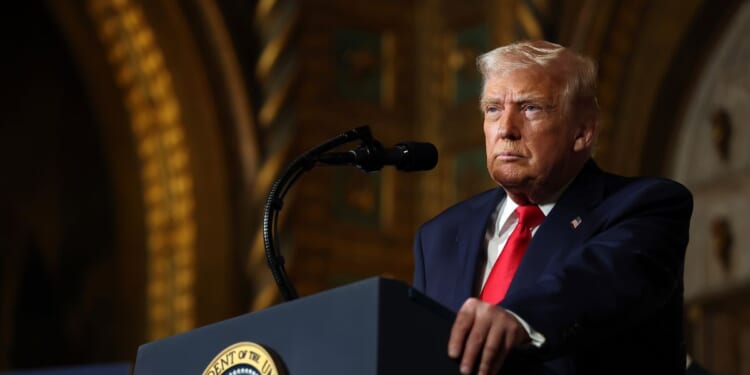 President Donald Trump answers questions at his Mar-a-Lago estate on Dec. 22, 2025.