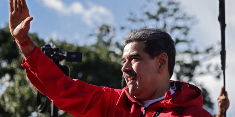 President Nicolás Maduro of Venezuela greets his supporters during a rally to commemorate Indigenous Resistance Day on Oct. 12, 2025, in Caracas, Venezuela.