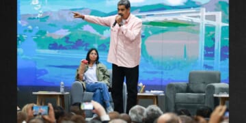 Then-Venezuelan President Nicolás Maduro, center, speaks next to Vice President Delcy Rodriguez, left, in a 2024 photo. Since Maduro's Saturday arrest, Rodriguez has issued orders to arrest those who supported the U.S. efforts to capture him.