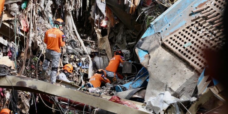 Filipino rescuers detect 'signs of life' in garbage avalanche that left dozens missing and killed 4