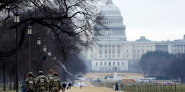 National Guard patrol the Washington Mall, with the U.S. Capitol in the background, on Jan. 9, 2026, in Washington, D.C.