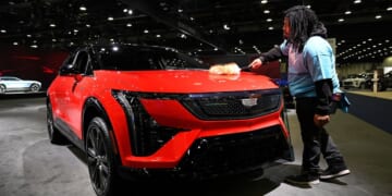 At Detroit auto show, spotlight dims for EVs