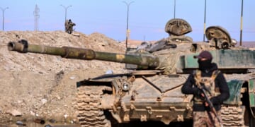 Syrian military says Kurdish guards abandoned IS-linked detainee camp