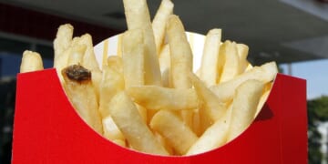 French fries, onions from loose shipping containers wash up on British beach