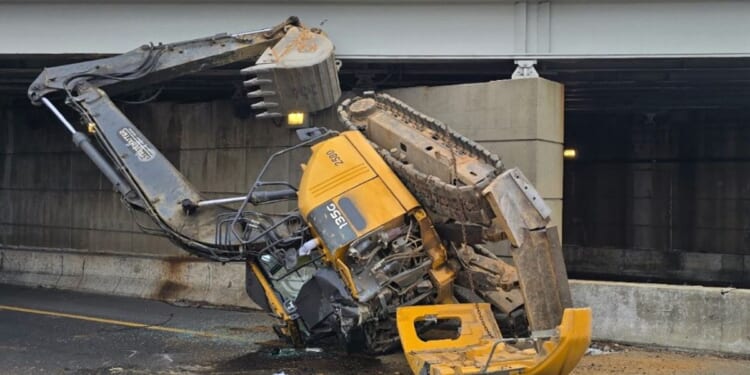 Excavator machine falls off transport truck on I-395 in D.C., leading to hazmat response