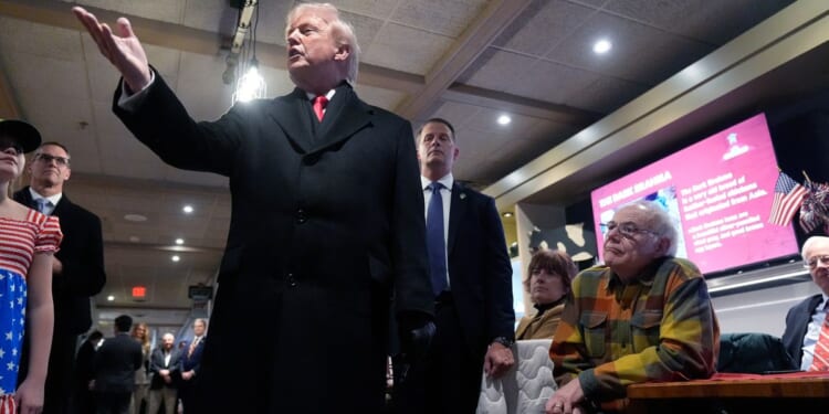 Trump launches midterm campaign blitz in Iowa, hails low gas prices and economic turnaround