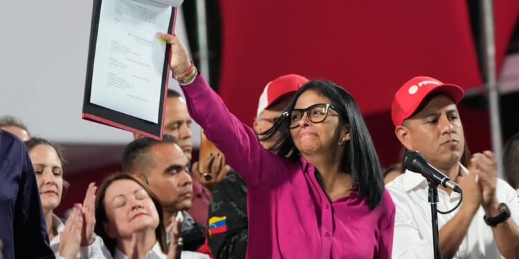 Venezuela's acting president signs oil industry overhaul to lure investors