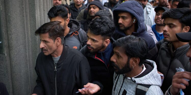 Spain gives hundreds of thousands of immigrants a way to stay legally. But who are they?