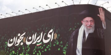 This picture shows a billboard bearing the portrait of Iranian supreme leader Ayatollah Ali Khamenei and a quote reads in Persian "Sing Oh Iran" at the Enqelab Square in Tehran on July 9, 2025.