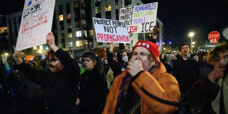 Anti-ICE activists march during a protest at the U.S. Immigration and Customs Enforcement facility on Jan. 9, 2026, in Portland, Oregon.