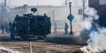 An armored vehicle arrives with Minneapolis police officers in Minneapolis, Minnesota, amid anti-ICE riots on Jan. 24, 2026.