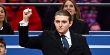 Barron Trump gestures after being acknowledged by his father, President Donald Trump, during the inaugural parade inside Capital One Arena, in Washington, D.C., on Jan. 20, 2025.
