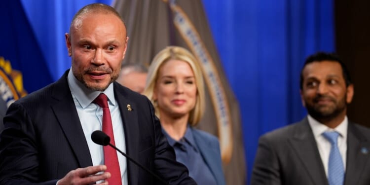 FBI Deputy Director Dan Bongino, accompanied by Attorney General Pam Bondi and FBI Director Kash Patel, speaks during a news conference on an arrest of a suspect in the Jan. 6 pipe bomber at the Department of Justice on Dec. 4, 2025, in Washington, D.C.