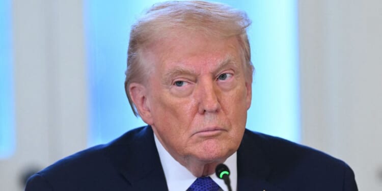 President Donald Trump listens at a meeting with US oil company executives in the East Room of the White House in Washington, DC on Jan. 9, 2026.