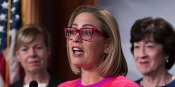 Now-former Sen. Kyrsten Sinema speaks to reporters following Senate passage of the Respect for Marriage Act at the U.S. Capitol in Washington, D.C., on Nov. 29, 2022.