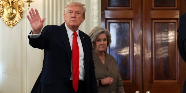 President Donald Trump departs with White House Chief of Staff Susie Wiles following a roundtable discussion in the State Dining Room of the White House on Oct. 8, 2025, in Washington, D.C.